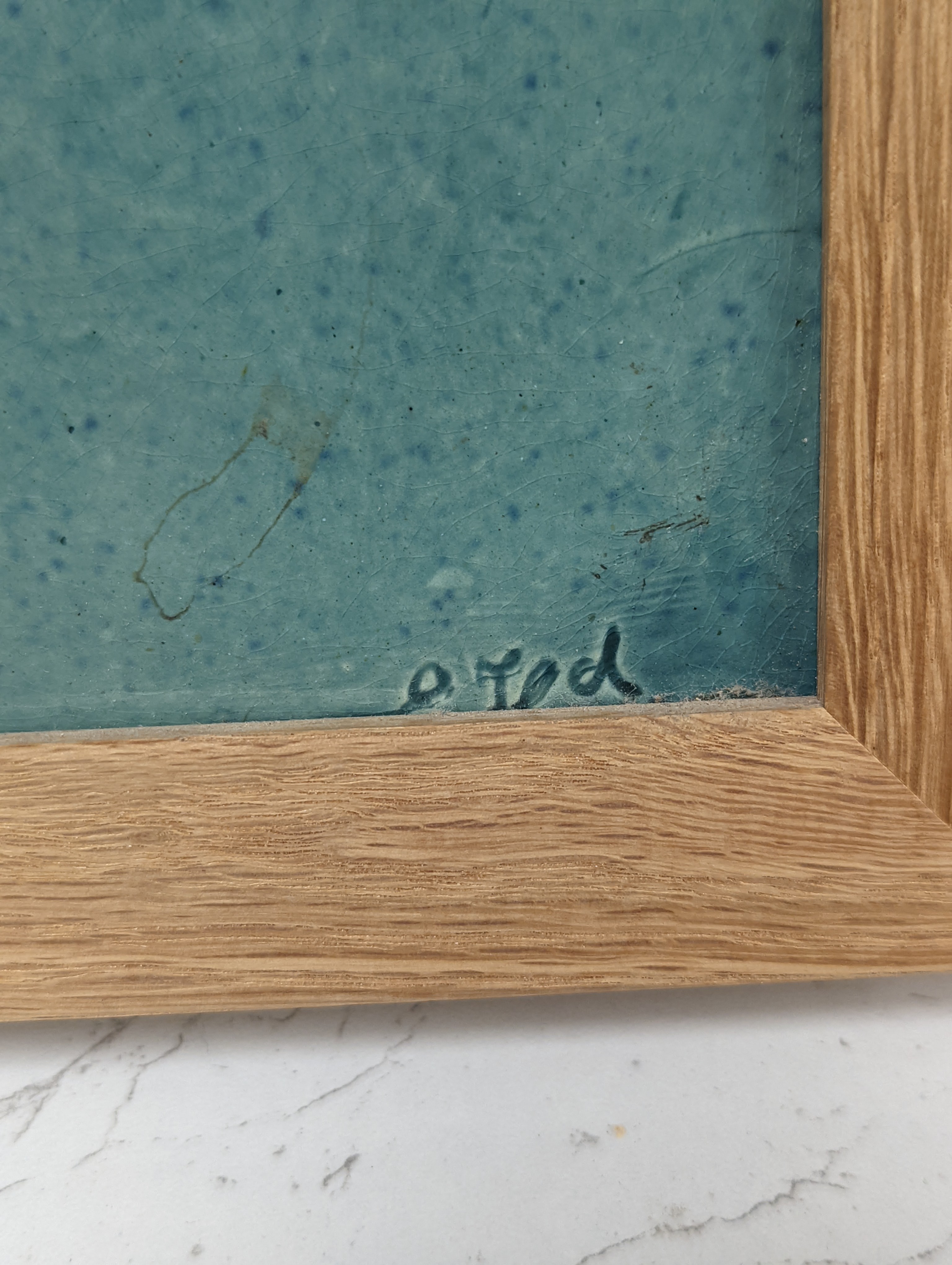 A pair of Burmantofts relief-moulded turquoise glazed portrait plaques, late 19th century, modern oak frames. 30x23cm